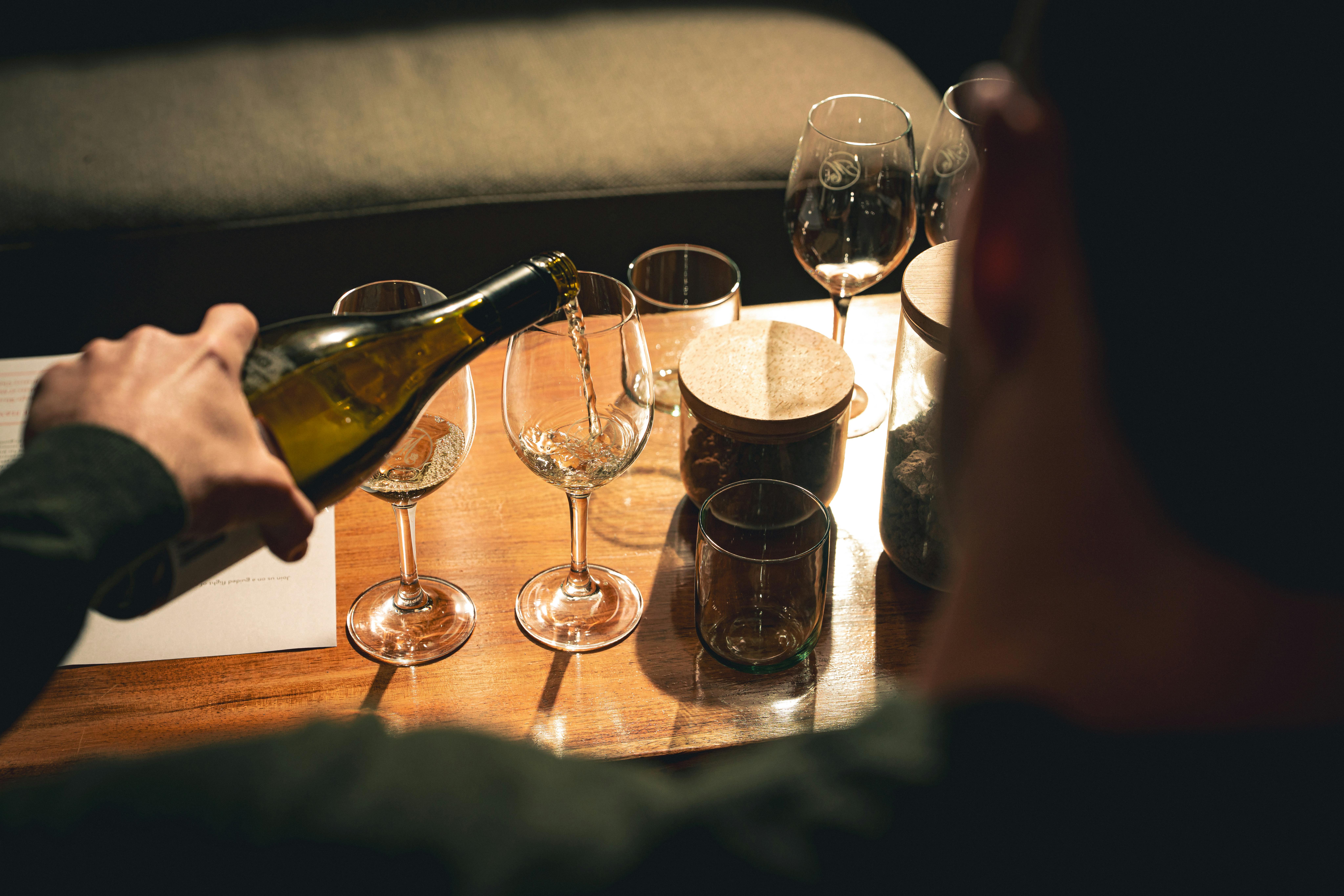 pouring wine landscape over shoulder